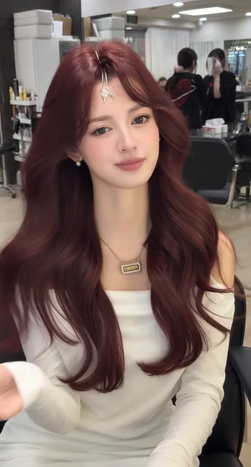 AI style reference · Burgundy-toned waves with a softly parted fringe.